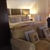 Hardwicke Hall Manor Hotel in Hartlepool guest room with sofa, bed, desk and mirror