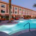 Cannery Casino Hotel, North Las Vegas: outdoor pool with palm trees and orange lounge chairs