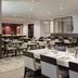 Hilton Washington DC/Rockville Executive Meeting Center dining room in Rockville with set tables and booths