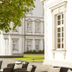 Althoff Grandhotel Schloss Bensberg in Bergisch Gladbach courtyard with tree, fountain and outdoor seating