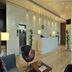 Marasa Sarovar Portico Rajkot lobby with reception desk, modern seating, and glass wall