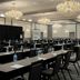 Four Points by Sheraton Milwaukee North Shore in Brown Deer meeting room with rows of tables, chairs and chandeliers