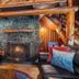 Copper Creek Inn, Cabins and Lodge in Ashford: rustic lodge seating area with stone fireplace and log beams