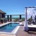 Thaiji Pousada e Parador in Florianopolis: oceanview pool deck with cabana and lounge chairs