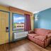 Econo Lodge Charlotte Airport Area room with sofa, window view and air conditioner in Charlotte