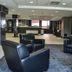 Residence & Conference Centre - Oakville lobby with black leather chairs and reception area