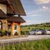 Silverton in Białka Tatrzańska with mountain views, parked cars, and a rustic stone exterior