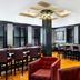Inn at Carnall Hall in Fayetteville bar and lounge with high-top seating and polished wood floors