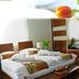 Euro Hotels Drzonków guest room with double bed, desk, chair, wardrobe, and flower decor