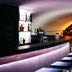 Parkhotel Fritz Am Brunnen in Schwelm bar interior with curved counter and backlit stools
