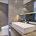 Orange Hotel Beijing Chaoyangmen Yabao Road Children's Hospital bathroom with vessel sink and toilet in Beijing