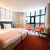 Montebelo Viseu Congress Hotel in Viseu: twin beds, curved window, and city views