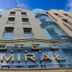 Hotel Admiral in Gdansk exterior with glass facade and large sign