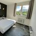 Hôtel Le Néron in Fontanil-Cornillon room with double bed and mountain view window