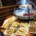 Le Beauséjour in Tregastel buffet table with pastries, cookies, and desserts under a clear display dome
