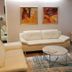 Wald-Hotel Troisdorf lobby lounge with cream sofas, round coffee table, and abstract wall art