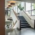 Go Hotel Østerport in Copenhagen lobby with central staircase, large windows and pendant lights
