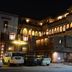 Night view of Hotel Harasar Haveli in Bikaner with illuminated arched balconies and parked cars