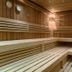 Vitalhotel Die Mittelburg in Oy-Mittelberg sauna with wooden benches and warm lighting