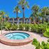 Best Western Plus Yacht Harbor Inn in Dunedin, outdoor hot tub surrounded by palm trees