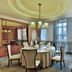 Parkyard Hotel Jiaxing in Jiaxing dining room with set round table, chairs, and large windows with sheer curtains
