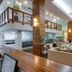 Hotel Behounek in Jáchymov lobby with seating area, mezzanine balcony, and wood-accented interior