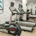 Fairfield Inn & Suites by Marriott New York Brooklyn gym with treadmills, an elliptical and mirrored wall