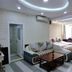 Shanghai Huijia Business Hotel in Shanghai guest room with sofa, bed, and ceiling cove lighting