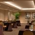 Hilton Orlando Lake Buena Vista meeting room with rows of banquet tables and potted plants