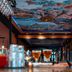 Ibis Styles Boulogne Sur Mer Centre Cathedrale bar with painted ceiling and glowing blue accents in Boulogne-sur-Mer