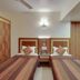 Hotel Centra-Ahmedabad in Ahmedabad guest room with two single beds, bedside table, and window