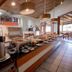 Ilha Flat Hotel in Ilhabela breakfast buffet with coffee urns and assorted pastries in a dining room