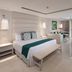 Grand Sirenis Riviera Maya Resort & Spa in Tulum: bright suite with king bed, balcony ocean view and seating