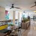 Fraser Suites Singapore lobby lounge with seating, ceiling fans and polished floors in Singapore