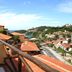 Rio Búzios Beach Hotel in Búzios with hillside terraces, terracotta roofs and ocean view