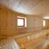 JUFA Hotel Bruck an der Mur sauna with wooden benches and small windows in Bruck an der Mur