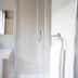 Hôtel de France Boulogne-Billancourt bathroom with sink, mirror, shower and towel rack