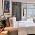 Kurhotel Skodsborg room in Copenhagen with twin beds, balcony door, and sea view