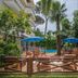 Hotel Kyrton, Forte dei Marmi: tropical garden pool area with loungers, umbrellas and palms