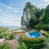 Railay Phutawan Resort in Ao Nang with cliffside pool and lush tropical hillside views