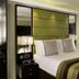 Montcalm Brewery Townhouse in London guest room with king bed and mirrored wall