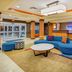 Fairfield Inn & Suites by Marriott Cookeville lobby with curved blue seating and front desk