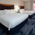 Fairfield Inn & Suites by Marriott Seattle Bremerton room with two beds, desk, TV and window seating