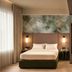 Unaway Hotel Occhiobello A-13 room in Rovigo with bed, open wardrobe and soft window light