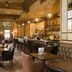 Hotel du Vin Brighton bar and lounge with leather seating, wood paneling, and a long drinks counter