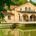 Wellness Resort Romantika in Hauzenberg with a canal-side facade and reflections in the water