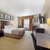 Best Western Plus St. Albert guest room with king bed, desk, TV, and jetted tub in Saint Albert