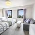 Reisenkaku Hotel Kawabata room in Fukuoka with twin beds, sofa, TV and city-view windows