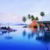 Samui Buri Beach Resort in Ko Samui with oceanfront infinity pool, loungers, and palm trees