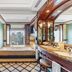 Makati Shangri-La, Manila bathroom with soaking tub and city skyline view in Makati